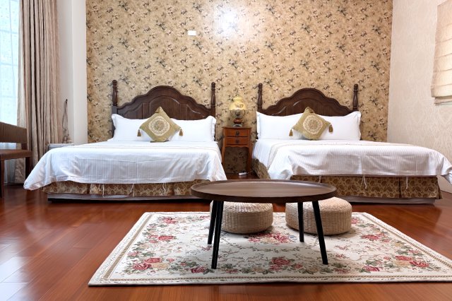 There are adorable teddy bear dolls in the room.